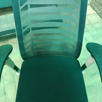 Clean green office chair after upholstery cleaning