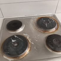 Dirty rusty stove before professional cleaning